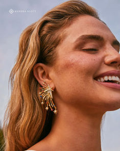 Arced lines dotted with crystal studs and star-shaped embellishments mirror a dramatic firework display, creating a dazzling look you’ll wow in ✨ Dangling Star Earrings, Firework Display, Gold Statement Earrings, Star Jewelry, Crystal Drop Earrings, Crystal Drop, White Crystal, Brass Material, Dillard's