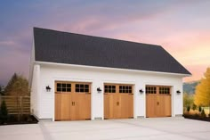 a three car garage with two doors on each side