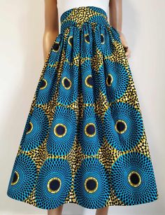 Handmade Unlined African Print Midi Skirt     Elastic waist band skirt at the back      2 open side-entry pockets     Exact length: 32"      100% Wax Cotton     Handmade     Made in the UK (Colours may vary due to lighting on images. The product images are closest to the true colour of the product.) African Print Midi Skirt, Mid Calf Skirt, African Print Skirt, Handmade Uk, Waxed Cotton, Mid Calf, African Print, Elastic Waist, Midi Skirt