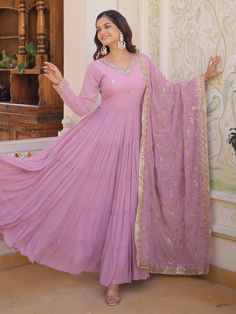 Elevate your style with our stunning pretty light purple sequins georgette function wear gown with dupatta. This gorgeous gown is crafted from light purple georgette material and adorned with intricate embroidered and sequin work, making it the perfect choice for festivals, events, or any special function.
The gown comes fully stitched in sizes ranging from XS to XXL, ensuring a perfect fit for every body type. With a 12-meter flair and a gown length of 56 inches, this gown exudes elegance and g Purple Georgette Dress With Sequins, Lavender Floor-length Anarkali Set For Wedding, Purple Sequined Georgette Dress, Sequin Georgette Anarkali Set Maxi Length, Maxi Length Sequined Anarkali Set In Georgette, Sequined Maxi Length Georgette Anarkali Set, Purple Sequin Dress For Eid, Lavender Designer Dresses For Eid, Festive Lavender Georgette Sharara