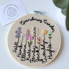 a cross stitch pattern with flowers and the words grandma's garden written on it