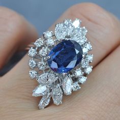 Certified 6.30CT (E-F / VS2-SI1) Oval, Round, and Marquise Cut Diamond and Blue Sapphire Engagement Ring in 18KT White GoldCenter: 1 oval cut blue sapphire weighing 3.50 caratSide Stones 1: 16 round cut diamonds weighing 1.00 caratSide Stones 2: 10 marquise cut diamonds weighing 1.80 caratGet inspired with our 6.30 ct diamonds and blue sapphire - engagement ring MDL#PSRI1177. This engagement ring is designed with 2.80 carat side diamonds. At Primestyle.com, we deal ONLY with 100% real, natural a Luxury Sapphire Diamond Ring, Luxury Blue Marquise Cut Sapphire Ring, Luxury Engagement Ring, Luxury Stuff, Fancy Sapphire, Blue Sapphire Engagement Ring, Luxury Engagement Rings, Sapphire Wedding Rings, Jewellery Design Sketches