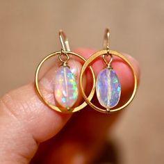 Golden Hoop earrings matched with two gorgeous opals that are a blue hue with a rainbow flash inside. These really bring a fun look to any outfit. Golden Hoops - Gold Vermeil (over .925 sterling silver) Ethiopian Opals - 14 x 9 mm 14 K Gold Filled Ear Wire Length: 1 1/4” Golden Hoop Earrings, Opal Drop Earrings, Golden Hoops, Hoops Gold, Blue Hues, A Rainbow, Ear Wire, Ethiopian Opal, Gold Vermeil