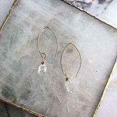 These delicate Herkimer Diamond dangles are perfect for that minimalist yet feminine look. Dressy enough for a bride or just an everyday outfit. Made with 14k gold fill, or rose gold or sterling silver. Ear wires are hand shaped for a unique organic look. Hypoallergenic.Measures 1.5” in length. Diamond Bezel Bracelet, Promise Necklace, Ear Art, Bezel Bracelet, Art Deco Bracelet, Bold Earrings, Diamond Dangle Earrings, Diamond Glitter, Onyx Bracelet