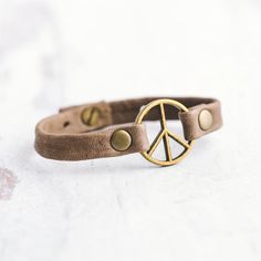 a peace sign bracelet on top of a table