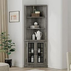 a living room with a bookcase and chairs in it, next to a window