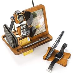 a cell phone holder with sunglasses, camera and other items