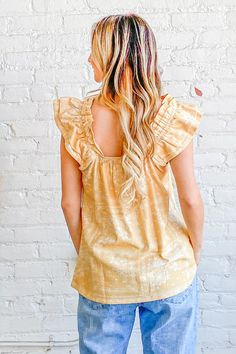 Flutter into spring in style with this bohemian dream of a top. Its cotton blend fabric feels featherlight against your skin as you sway in the warm breeze. Delicate ruffles and an empire waist give it an ethereal quality, while the square neckline and short flutter sleeves keep it flirty. Whether you're dancing at a music festival or strolling through the Saturday market, this top moves with you. Let the vibrant print transport you to exotic lands as you pair it with cutoffs for a casual look o Rachel Clark, There She Goes, Styling Guide, Flutter Sleeve Top, Boho Print, New Inventory, Cotton Blend Fabric, Printed Linen, Top Sales