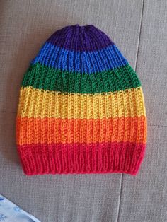 "Winter Rainbow knit hat Gay hat LGBT clothes  Valentine's slouchy beanie Gay pride clothes Long handmade cap Unisex rainbow beanie Pride hat This unisex LGBT  rainbow colors hat is made of  super soft vegan  yarn. One size slouchy beanie suits most. It's perfect choice as a gift for your partner.  Upon your request  could be made one more if you love couple things wearing. One size fits average t or adult head size of 22.5\" to 24\" (56 cm to 60 cm). Fill free to visit my shop and see what  we ofer more  http://etsy.me/2HPJLAT" Gay Crochet, Rainbow Knitting, Gay Clothes, Rainbow Goth, Pride Clothes, Rainbow Beanie, Pride Accessories, Slouchy Beanie Hats, Baby Crochet Patterns Free