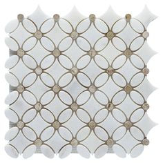 a white and gold tile with circles on it