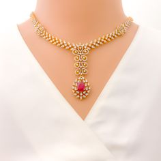 This exquisite 18k gold set, weighing 62.8 grams, features a stunning floral design adorned with dazzling diamonds and rubies. The yellow gold finish enhances its luxurious appeal, making it perfect for any special occasion. The set includes a necklace with a total diamond weight of 8.34 carats, featuring F-G color and VS quality diamonds in round shapes. The rubies are elegantly shaped in pears and are interchangeable, adding versatility to the design. The necklace has a length of 16.75 inches Formal Ruby Diamond Necklace With Brilliant Cut, Luxury Ruby Diamond Necklace With Diamond Accents, Luxury Ruby Diamond Necklace With Accents, Formal Bridal Necklace In Yellow Gold With Gemstone, Luxury Ruby Round Bridal Necklace, Luxury Round Ruby Bridal Necklace, Formal Yellow Gold Bridal Necklace With Gemstone, Luxury Ruby Bridal Necklace, Formal Red Diamond Necklace With 17 Jewels