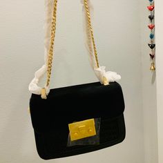 Perfect - For The Night And For The Day. Can Be Worn Many Different Ways - Crossbody / Sling Bag/ Shoulder Bag With Short Chain / Clutch Spacious Enough For Iphone Max Size. Robust And Firm Bag. With Gold Hardware And Black Velvet Flap And Braided Design. Red Interior. Brand New. Never Used. Square Shoulder Bag With Chain Strap For Evening, Evening Satchel Shoulder Bag With Chain, Shoulder Bag With Chain Strap For Night Out, Evening Shoulder Bag With Chain, Crossbody Evening Bag With Chain Strap For Shopping, Evening Crossbody Shoulder Bag With Chain, Evening Crossbody Bag With Gold Chain, Evening Crossbody Bag With Chain, Chic Evening Shoulder Bag With Gold Chain