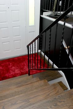 there is a red carpet on the stairs