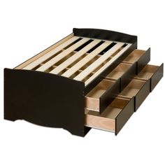 a bed with drawers underneath it on top of a white background and the bottom drawer is open