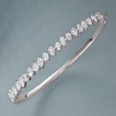 Indulge in luxury with this breathtaking 4 1/2 carat multi-shape diamond bangle bracelet. Crafted in 14K solid gold, this elegant piece features a stunning array of diamonds in various shapes, expertly set to reflect maximum brilliance. Perfect for special occasions or adding a touch of sophistication to your everyday look, this bracelet is a statement of timeless elegance and refined beauty.Designed for women who appreciate luxury, this diamond bangle combines classic craftsmanship and modern s Diamond Accents Baguette Cut Bangle, Diamond Baguette Cut Bangle With Accents, Luxury Marquise Cut Diamond Bracelet For Anniversary, Luxury Marquise Cut Diamond Bracelet For Formal Occasions, Luxury Marquise Cut Diamond Bracelet For Formal Events, Luxury Wedding Diamond Bracelet With Marquise Cut, Fine Jewelry Diamond White Baguette Cut Diamond Bracelet, Fine Jewelry Diamond White Baguette Cut Bracelet, Elegant Diamond Bangle With Baguette Diamonds