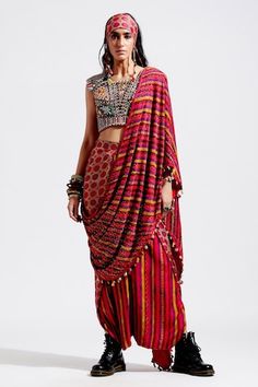 Red pre-draped saree, with multi color printed motifs, highlighted with sequins  spread and cowry shells and tassel embellishments.
Component: 1
Embellished
Fabric: Cotton Silk, Georgette
Color: Red, Multi Color
Cowry shells and tassels on palla hem
Note: The blouse and the bandana worn by the model is for styling purpose only - Aza Fashions Navratri Draped Choli With Mirror Work, Traditional Draped Choli With Mirror Work, Designer Wear Dupatta With Tassels For Diwali, Designer Multicolor Tassel Dupatta, Red Traditional Pre-draped Saree For Transitional Season, Festive Red Pre-draped Saree With Printed Motifs, Red Pre-draped Saree For Transitional Season, Festival Draped Choli With Mirror Work, Navratri Draped Traditional Wear With Mirror Work