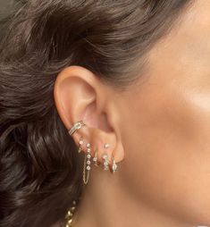 Introducing our Biggie Baguette Ear Cuff: an exquisite creation made of 14K Yellow Gold, embellished with .64 CTS of dazzling white baguette diamonds set in an alluring channel. This opulent, stand-alone piece effortlessly elevates any ensemble with its captivating diamond brilliance, providing a touch of sophistication and glamour. No piercing required. Available in White or Rose gold by special order Each piece is sold separately. Sparkling Diamond Jewelry For Evening, Classic Sparkling 14k Gold Jewelry, Evening Sparkling Diamond Jewelry, Formal Baguette Diamond Jewelry, Luxury Baguette Diamond Jewelry, Diamond Baguette Jewelry With Prong Setting, White Gold Baguette Jewelry With Single Cut Diamonds, Baguette Diamond Jewelry With Prong Setting, Baguette Shaped Single Cut Diamond Jewelry