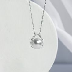 South Sea saltwater cultured pearl 18K solid gold, and diamonds Size: 1 pearl 10-11 mm, 1pc Weight of diamonds: 28 diamonds, around 0.142 carats in total Chain length: 42+3 cm (adjustable) Pendant parameters: 1.3*1.5 cm Handpicked of every pearl, only the top 1% of pearls are selected Handcrafted Lifetime warranty Discount codes are not available for this product. Haute Jewelry, Modern Necklace, Sea Pearl, Modern Necklaces, South Sea Pearls, South Seas, Sea Pearls, Diamond Sizes, Discount Codes