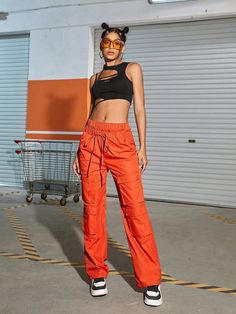 Make a bold fashion statement with these Orange Waist Flap Pocket Cargo Pants. Their plain pattern and high waistline add a touch of sophistication to your casual look. The drawstring waist ensures a comfortable fit, while the non-stretch fabric offers durability. These long-length pants are ideal for any occasion, and the waist flap pockets add a trendy twist. Details: Color: Orange Style: Casual Pattern Type: Plain Type: Cargo Pants Closure Type: Drawstring Waist Waist Line: High Waist Length: Trendy Non-stretch Parachute Pants With Cargo Pockets, Trendy Loose Fit Cargo Pants Ankle-length, Urban High Waist Parachute Pants For Summer, Urban High-waist Parachute Pants For Summer, High Waist Summer Cargo Pants With Drawstring, High Waist Drawstring Cargo Pants For Summer, Chic High Waist Parachute Pants For Streetwear, Sporty High Waist Pants With Drawstring, Sporty High Waist Drawstring Pants