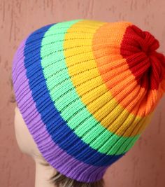 a woman's head wearing a multicolored hat