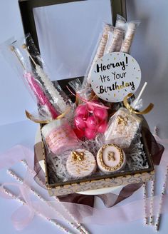 a birthday gift box with candles, cookies and marshmallows for someone's 30th birthday