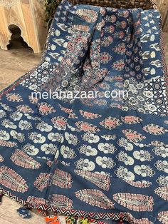 "Handmade Ajrakh patchwork dupatta on pure cotton. \"Designs vary\" Note : since these Dupattas are are handmade and handprinted using natural dyes and sundried in the open, some inconsistency may be present and they may smell of the natural dyes until washed .  These are not defects rather make each piece unique!" Cotton Dupatta With Batik Print For Diwali, Blue Cotton Dupatta With Printed Motifs, Indigo Cotton Dupatta With Block Print, Unstitched Cotton Batik Print Saree, Unstitched Cotton Saree With Batik Print, Bohemian Handloom Cotton Saree, Festive Indigo Cotton Dupatta, Indigo Block Print Dupatta For Diwali, Blue Cotton Dupatta With Kalamkari Print