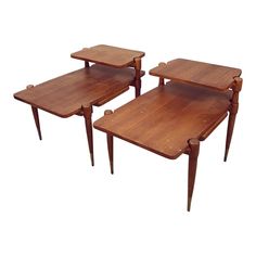 three wooden tables sitting on top of each other