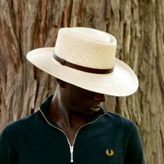 Bolero panama hat wide brim. Fedora hat made of natural straw in natural-ivory color for men and women. Finished with a beautiful eco leather belt. Elegant fedora for man and woman. The measurements in centimeters are 36 x 34. Brim length 9.5. Crown height 9.5 . (These measurements may vary slightly depending on the size of the hat) For its elaboration we only use hoods and capelines of resistant natural straw (genuine paja toquilla) of very good quality. In our workshop in the Pyrenees we sew a Mens Panama Hat Outfit, Classic Tan Hat For Summer, Classic Tan Summer Hat, Classic Adjustable Summer Hat, Tan Curved Brim Panama Hat For Summer, Adjustable Tan Panama Hat With Curved Brim, Adjustable Tan Panama Hat With Short Brim, Tan Wide Brim Panama Hat For Summer, Adjustable Tan Wide Brim Panama Hat