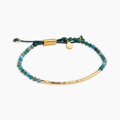 Apatite is for: Inspiration Independence Ambition Apatite has an ambitious energy that stirs the intellect, giving birth to thoughts and ideas that in turn promote inspiration. Genuine gemstone and golden hammered bar accent this stackable adjustable bracelet. Product Details Bar measures 2" across Bracelet extends out to 9" Waxed cotton & nylon cords Genuine gemstone Natural color variance may occur Available in 18k gold plated and silver plated brass Avoid contact with water and anything c Intention Bracelets, Designer Clothing Brands, Giving Birth, Waxed Cotton, Adjustable Bracelet, Gemstone Bracelet, Natural Color, Rope Bracelet, Jewelry Ideas