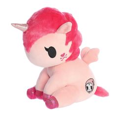 a pink stuffed animal with horns on it's head and tail, laying down