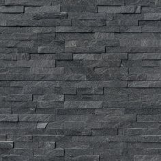 a black stone wall is shown in this image