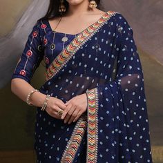 Blue colored saree is made from georgette fabric which is highlighted with beautiful bandhej printed work as shown. Comes along with unstitched mono silk blouse piece which you can customise as per your design/style. Occasion - You can wear this saree for party, functions and fashionista. Note:- the actual product may differ slightly in color and design from the one illustrated in the images when compared with computer or mobile screen. Measurements: Saree : Georgette : 5.5 Mtrs Blouse : Georget Festival Georgette Pre-draped Saree With Border, Festival Georgette Pre-draped Saree With Printed Border, Bollywood Georgette Traditional Wear With Printed Border, Navratri Georgette Traditional Wear With Bandhani Print, Bandhani Print Georgette Traditional Wear For Navratri, Bollywood Traditional Wear In Georgette With Printed Border, Blue Pre-draped Saree With Printed Border, Designer Georgette Sets With Printed Border, Designer Bandhani Print Georgette Blouse Piece