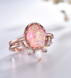 Opal Wedding Ring Set Oval Pink Fire Opal Engagement Ring Vintage Sterling Silver Ring Opal Matching Band Promise Ring Bridal Set Unique wedding set,perfect as engagement/wedding ring, birthday or anniversary gift, etc. Engagement Ring ❀gemstone is 8x10mm oval cut lab-created pink fire opal❀ ❀925 Sterling Silver,Rose/White/Yellow Gold Plated❀ Wedding Band ❀2.5mm+1.5mm Round cut and 3x5mm Pear cut lab-created white fire opal❀ ❀Curve height 4mm,curve width 9mm. ❀925 Sterling Silver,Rose/White/Yell Dark Opal Engagement Ring, Black Fire Opal Engagement Ring, Oval Prong Setting Bridal Sets As Gift, Oval Bridal Sets With Prong Setting As Gift, Oval White Gold Crystal Wedding Ring, Oval Bridal Sets With Prong Setting, Gold Oval Cabochon Opal Ring For Wedding, Gold Bridal Sets With Round Gemstone, Oval Bridal Sets With Prong Setting For Wedding