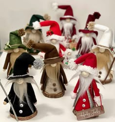 a group of gnome figurines sitting on top of a white table next to each other