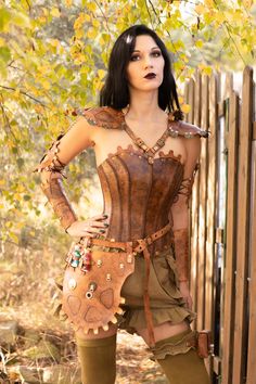 Its uniqe custom project for steampunk lover. Set include: corset, pauldrons, bracers, alchemy belt, pants with purse,  It will fit for woman with sizes XS/S bust - 78-85cm waist - 58-64cm bottom - 80-88cm Please mesure yourself before buy. Material of corset and adds: Natural hard Leather, Cattle Hide - Vegetable Tanned. Painted and etched by hand. https://www.etsy.com/shop/SteampunkAndFantasy Please read my shop policies for info on shipping, returns, and guarantees: https://www.etsy.com/shop/ Steampunk Leather Corset Belt For Cosplay, Steampunk Leather Corset For Cosplay, Steampunk Fitted Corset For Cosplay Events, Gothic Leather Corset For Cosplay, Steampunk Overbust Corset For Cosplay Events, Steampunk Corset For Cosplay And Costume Parties, Steampunk Corset Dress For Cosplay Events, Steampunk Corset For Costume Party And Cosplay Events, Brown Steampunk Corset Dress For Costume Party