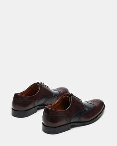 Experience the timeless style and sophistication with our EDREES dress shoes. Made with a genuine leather upper and featuring a classic wingtip design, these lace-up dress shoes blend perfectly with any formal outfit. Elevate your wardrobe with these expertly crafted, stylish, and comfortable dress shoes. 1 inch heel height Leather upper material Textile and synthetic lining Textile and synthetic sock Rubber sole Imported Wingtip Oxford Lace-up Shoes With Textured Sole, Timeless Brown Oxford Lace-up Shoes, Timeless Brown Lace-up Oxford Shoes, Brown Wingtip Lace-up Shoes For Semi-formal Occasions, Formal Wingtip Oxfords With Rubber Sole, Timeless Wingtip Oxfords For Formal Occasions, Wingtip Dress Shoes With Leather Sole, Formal Oxfords With Rubber Sole, Classic Semi-formal Oxfords With Perforated Toe Box