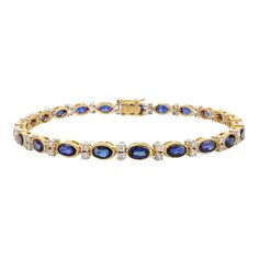 This is part of Chairish’s Fine Jewelry assortment.  This 6.91 CTW Natural Blue Sapphire Diamond Wedding Tennis Bracelet in 18K gold showcases endlessly sparkling natural blue sapphire of 6.91 carats and 0.97 carats diamonds. It measures 7.25 inches long in length.  Sapphire stimulates concentration and reduces stress.  Designed with perfect oval cut blue sapphire set with a diamond to make you stand out on any occasion or event. The elegant style complements the attire beautifully and is a perf Gold Tennis Bracelet, Perfect Engagement Gifts, Bracelet Tennis, Mom Wedding, Gift Valentine, Blue Sapphire Diamond, Art Deco Diamond, Natural Blue Sapphire, Sapphire Gemstone