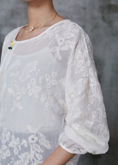 Handmade White Embroidered Cotton Shirt Top SummerFabric: Cotton BlendedSize & Fit: Fit: This garment fits true to size.Length: Size S measures 25.74"from shoulder to hemBust: Great for any cup size. Waist: Loose Fit. Comfortable room throughout midsection.Hip: Loose Fit - room for hips. Hand Wash Cold. White Summer Shirt With Chikankari Embroidery, White Relaxed Fit Tops With Chikankari Embroidery, Spring Long Sleeve Tops With Chikankari Embroidery, Summer Long Sleeve Top With Chikankari Embroidery, Summer Long Sleeve Chikankari Embroidered Top, Elegant Blouse With Floral Embroidery And Relaxed Fit, Long Sleeve Cotton Shirt With Chikankari Embroidery, Long Sleeve Chikankari Embroidered Top For Summer, Chikankari Embroidered Long Sleeve Top For Summer