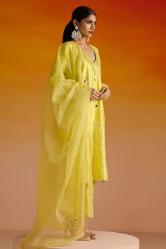 Yellow kurta with mirror and beads work hand embroidery. Paired with a matching plain pant with embroidered hemline and an embroidered dupatta. - Aza Fashions Festive Straight Kurta Pant Set With Mirror Work, Festive Pant Set With Mirror Work And Straight Kurta, Designer Mirror Work Straight Kurta Pant Set, Designer Straight Kurta Pant Set With Mirror Work, Summer Salwar Kameez With Mirror Work And Straight Kurta, Designer Chanderi Pant Set With Mirror Work, Summer Salwar Kameez With Mirror Work, Summer Georgette Kurta With Mirror Work, Festive Semi-stitched Pant Set With Mirror Work