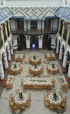 tables and chairs are set up in the courtyard