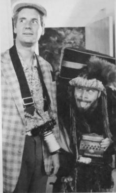 an old photo of two people dressed up as characters from the wizard and the person in the hat