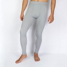 For those who demand more from every move. Designed to not just keep up, but to amplify your journey as an athlete. Featuring an athletic fit, superior durability, enhanced muscle support and performance. EXOSKLTN Men's ExoPro Sport leggings in Cool Grey. Product Benefits: Unmatched Durability: EXOSKLTN leggings are rip-proof and anti-pilling, designed to withstand intense training sessions. The reinforced stitching ensures the leggings withstand regular wear and tear. Perfect Second-Skin Fit: E Squat Proof Solid Leggings For Running, Compression Squat Proof Tights For Pilates, Solid Sporty Squat Proof Tights, Gray Fitted Moisture-wicking Activewear, Compressive Squat Proof Sportswear Tights, Compressive Squat-proof Leggings, Compressive Squat Proof Running Leggings, Compressive Squat Proof Solid Color Tights, Breathable Functional Leggings For Running