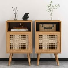 two wooden side tables sitting next to each other