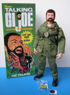 the action figure is posed next to an advertisement for his talk show, talking g i joe