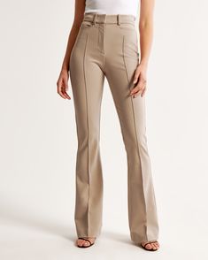 Elevate your wardrobe with the Abercrombie & Fitch Women's High Rise Flare Pant in an elegant Clay Brown. These pants are designed to flatter, fitting snugly at the waist and hips while relaxing slightly at the thigh and flowing into a full-length flare leg. Perfect for a sophisticated look, they feature:

- Size: 32 SHORT
- Color: Clay Brown
- Material: Body - Polyester blend; Pocket Bag - Polyester
- Gender: Female
- Key Details: Stretch menswear fabric, sleek pintuck detail, functional front Tailored Pants Women, High Rise Flare Pants, Female Features, Abercrombie (women), Ankle Dress Pants, Flare Pant, Business Casual Outfits For Work, High Waisted Mom Jeans, Bootcut Pants