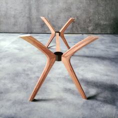 a wooden table sitting on top of a cement floor