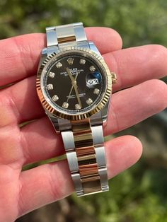 This stunning 2021 Rolex Datejust watch features a beautiful black diamond dial and a 36mm yellow gold case. The watch is a women's model and comes with a bracelet strap. It is powered by a mechanical automatic movement and has a power reserve indicator along with sapphire crystal. The watch also has a yellow bezel color and non-numeric hour marks. It comes with a seller warranty and papers, but does not have original box packaging or service records. The reference number for this watch is 126233 and it was manufactured in Switzerland. This analog watch is a great addition to any collection and is sure to catch the eye of any watch enthusiast. Rolex Datejust Model 126233 Steel & yellow gold 36mm case Oyster bracelet Black diamond dial Sapphire crystal Automatic movement 2021 Rolex warranty Rolex Black Dial, Rolex Date Just, Rolex Day Date 36 Gold, Rolex Daydate 36mm, Rolex Day Date 36 Yellow Gold, Oyster Bracelet, Rolex Watch, Analog Watch, Bracelet Black