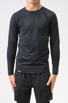 Long sleeve athletic top -Compression fit shirt -Crewneck -Moisture wicking technology to keep skin dry -UV protection -85% polyester 15% spandex Elastane Long Sleeve Sports Tops, Long Sleeve Elastane Sports Tops, Functional Moisture-wicking Elastane Tops, Technical Elastane Stretch Tops, Moisture-wicking Black Crew Neck Rash Guard, Black Moisture-wicking Crew Neck Rash Guard, Technical Black Top For Outdoor, Technical Stretch Tops Made Of Elastane, Functional Black Elastane Top