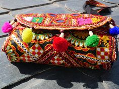 Small festival Bag - Banjara purse - boho clutch - hippie chic Patchwork with "Banjara" cotton vintage textiles with traditional Kantha embroidery, Mirrorwork and beads /pom poms Create your unique boho chic - Gypsy festival look with this handcrafted clutch bag. size: 6 x 10 inches length from shoulder till the bottom of the bag: 30 inches and with straps: 28 inches (from the shoulder till the bottom of the bag) Let me know if you have any questions. Namaste from India Sahera Jo