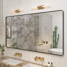 there is a bathroom with two sinks and a large mirror on the wall above it